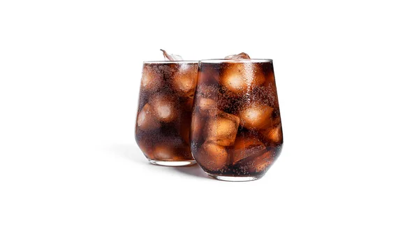 Soda with ice in a transparent glasses isolated on a white background. Stock Photo