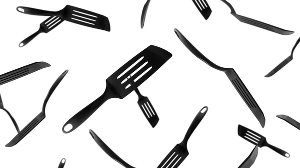 Black plastic kitchen spatula isolated on white background, Flying spatula. — Stock Photo, Image