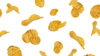 Beyaz arka planda mısır gevreği. Uçan mısır gevreği. Düşen mısır gevrekleri.