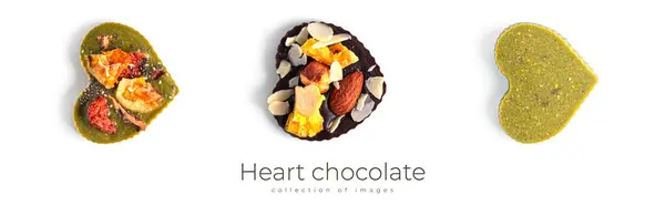 Chocolate em forma de coração cru com frutas secas e nozes em um fundo branco. — Fotografia de Stock