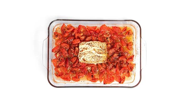 Oven baked feta pasta made of cherry tomatoes, feta cheese, garlic and herbs. Fetapasta isolated on white background Stock Photo