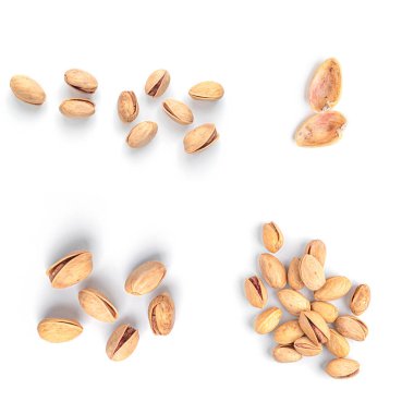 Beyaz arka planda fıstıklar. Ceviz koleksiyonu izole edildi.