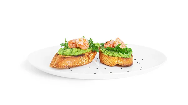 Sandwich with guacamole, shrimps, arugula, tomatoes, cucumber isolated on a white background. Bruschetta with avocado. Healthy breakfast.