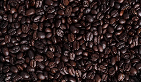 Kávová zrna pozadí. Hromada kávových zrn. Káva. — Stock fotografie