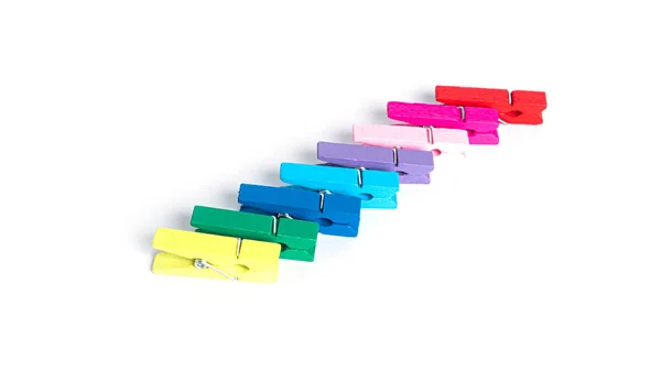 Wooden colorful clothespins isolated on a white background. — Stock Photo, Image