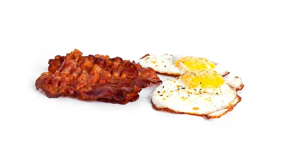 Fried eggs with fried bacon isolated on a white background. — Stock Photo, Image