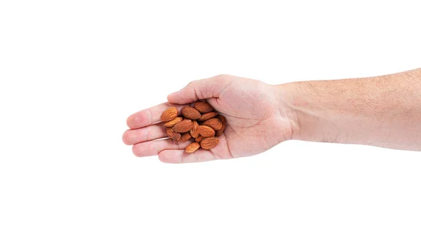 Almond nuts in the hand isolated on a white background. — Stock Photo, Image