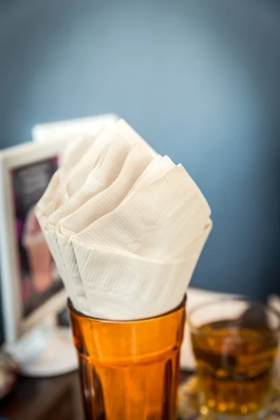 Brown tissue paper in glass — Stock Photo, Image