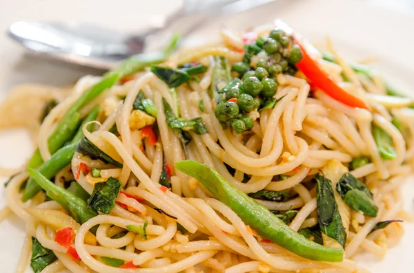 Thai style stir-fried spicy spaghetti — Stock Photo, Image