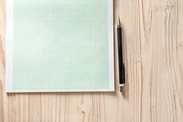 graph paper with pencil