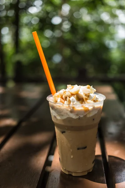 Ice coffee with macadamia nuts — Stock Photo, Image