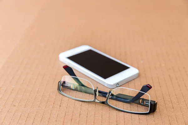 Phone and glasses — Stock Photo, Image