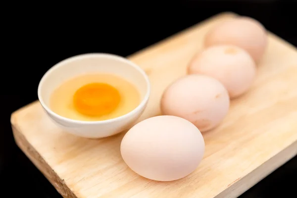 Raw eggs with yolk in bowl — Stock Photo, Image