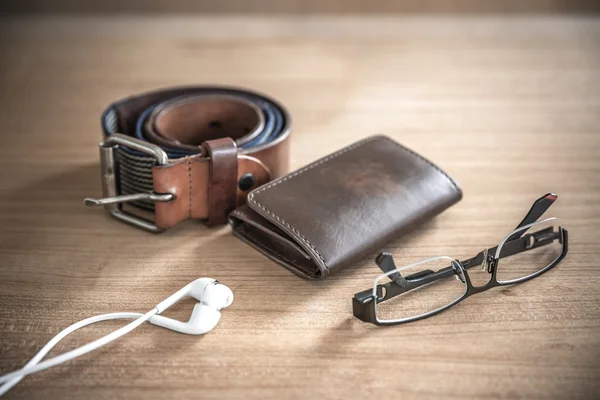 Brown wallet,belt, spectacles,earphones  vintage style — Stock Photo, Image