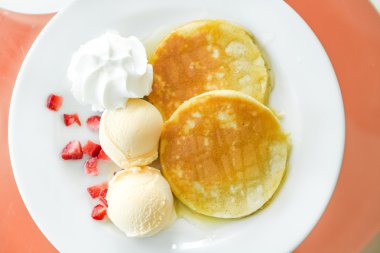 Pancakes with ice cream and syrup