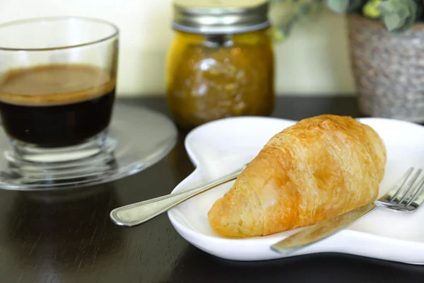 Coffee break with french croissant — Stok fotoğraf