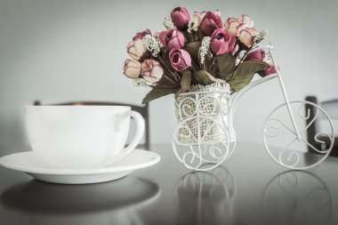 coffee and artificial flowers of modern