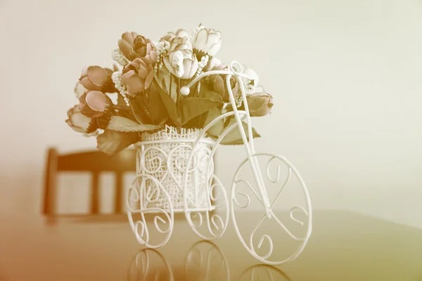 Artificial flowers in white bicycle — Stok fotoğraf