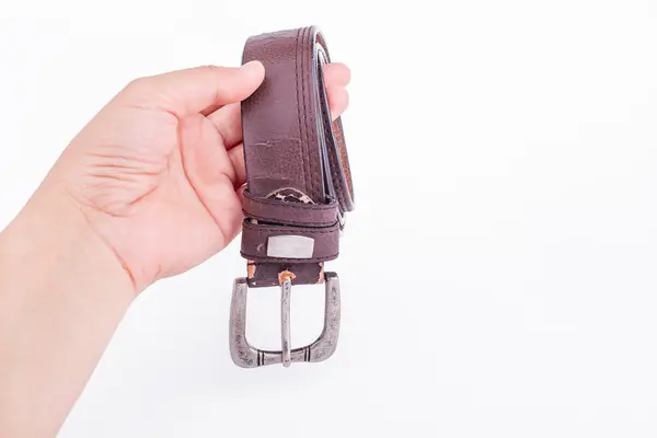 The man's hand holding a leather belt — Stock Photo, Image