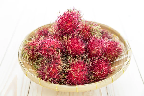 Fresh rambutan in basket — Stock Photo, Image