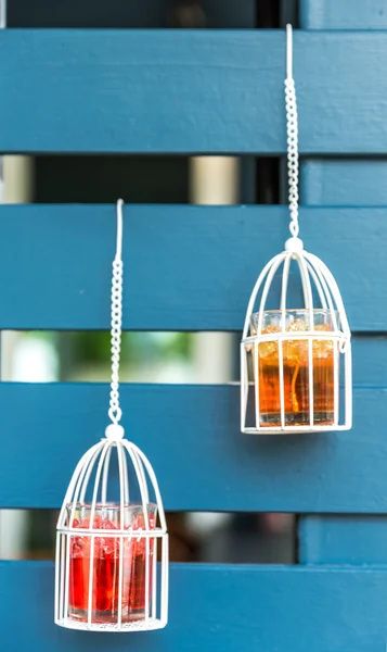 Birdcages decorated, white candles inside — Stock Photo, Image