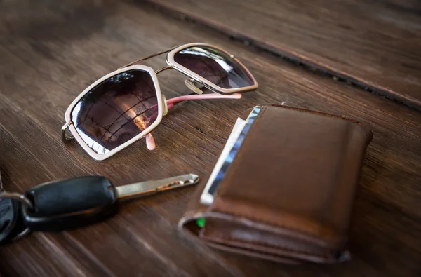 Sunglasses with wallet and car remote key — Stock Photo, Image