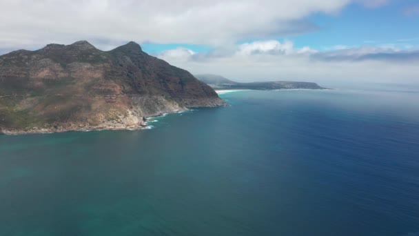 Aerial view. Chapmans Peak Drive near Cape Town, South Africa. Top view of road going through beautiful landscape. Road bending along the ocean. — Stock Video