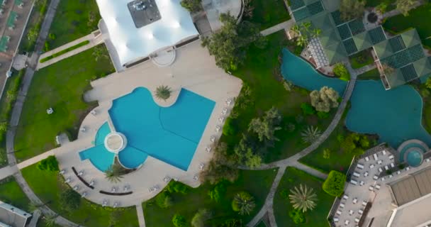 Aerial view. Summer day waterpark outdoor swimming pool relax zone. — Stock Video