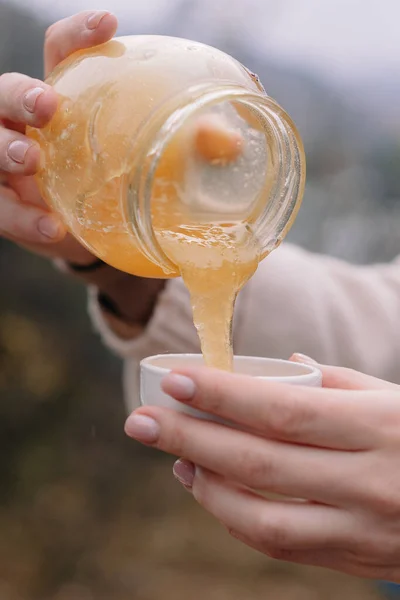 Hands Pour Honey Jar Saucer — Stock Photo, Image