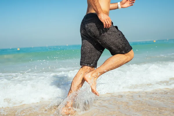 Running on the beach — Stock Photo, Image