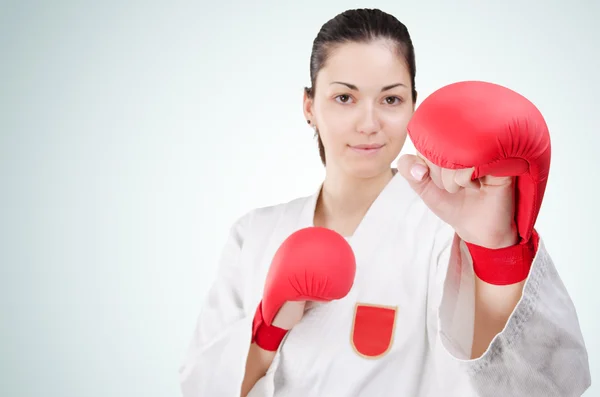 Young karate woman with glowes — Stock Photo, Image