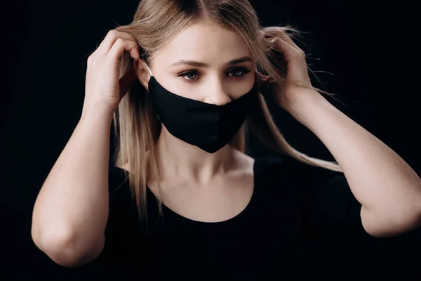 Woman in black mask posing in studio — Stock Photo, Image