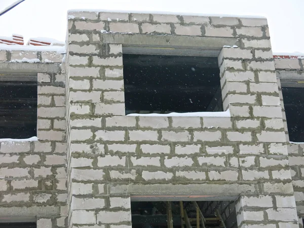 stock image three-story white concrete block house under construction