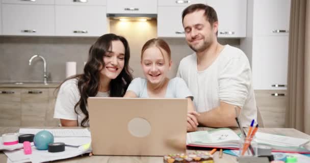 Family making video call to teacher at home — Stock Video