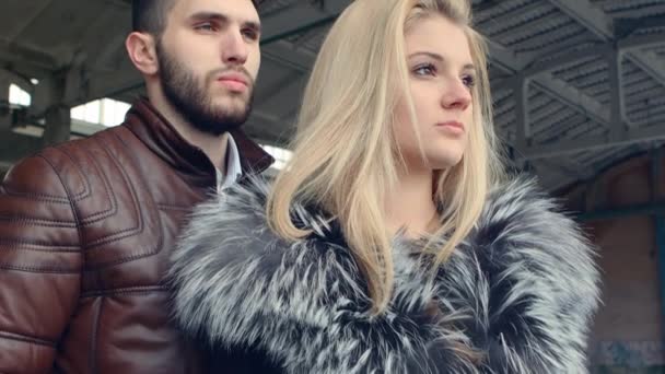 Cold arms of young bearded men and beautiful blonde in fur — Stock Video