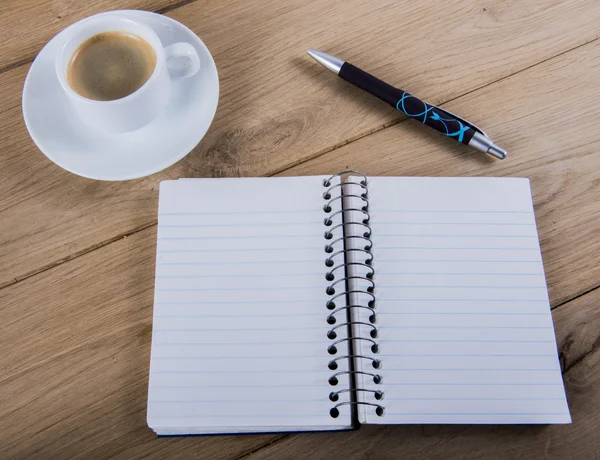 Coffee cup and notebook — Stock Photo, Image