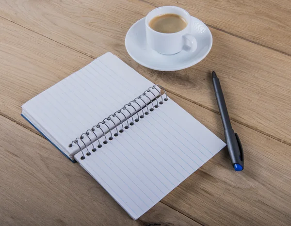 Coffee cup and notebook Stock Photo