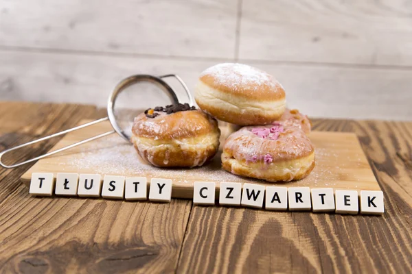 Fresh jummy donuts on wooden table — Stock Photo, Image