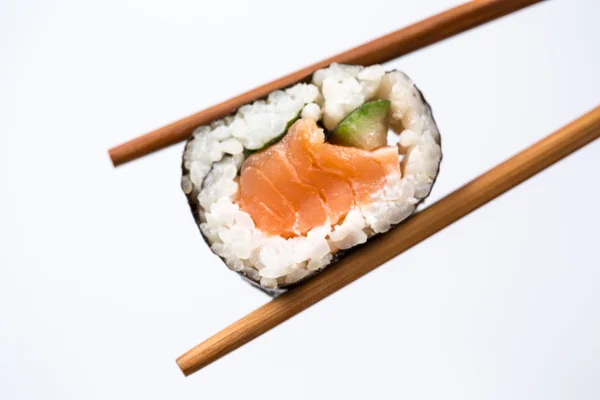 Sushi roll with bamboo chopsticks isolated on white background — Stock Photo, Image