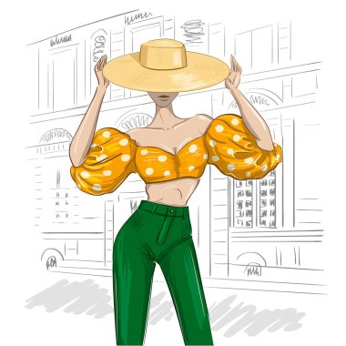 Şapkası ve balon kollu güneşli moda kadın kıyafeti.