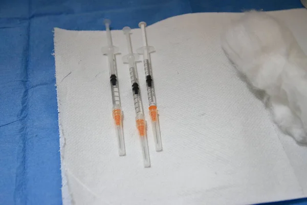 Naples, Italy - January 09,2021 : The Local Health Company 1 Naples Center , has established a Vaccination Center against Covid-19 . Indoor salt of the center anti-ovidium-19 vaccine.A nurse vaccinates an elderly person.