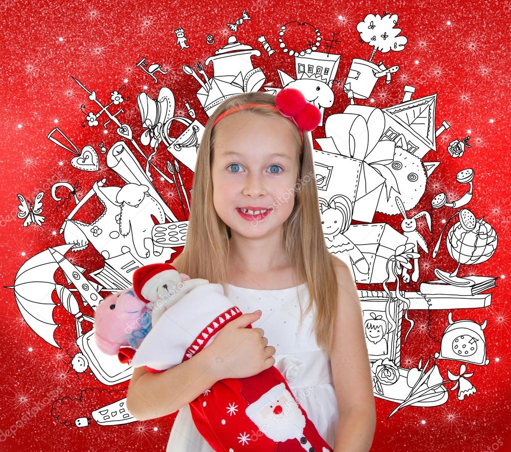 Little girl golding Christmas presents and doodle background with lots of toys