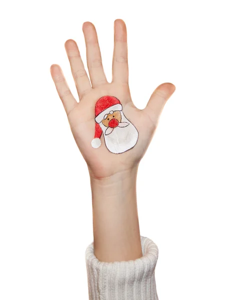 Children's hands raising up with painted Christmas symbols: Santa Claus, — Stock Photo, Image