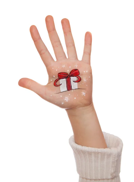 Les mains des enfants levant avec le symbole peint de Noël — Photo