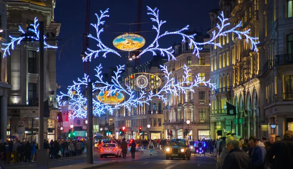 LONDON, UK - NOVEMBER 30, 2014: Black Friday weekend in London the first sale before Christmas. Regent street beautifully decorated with Christmas lights. Roads were open for pedestrians only — Stock Photo, Image