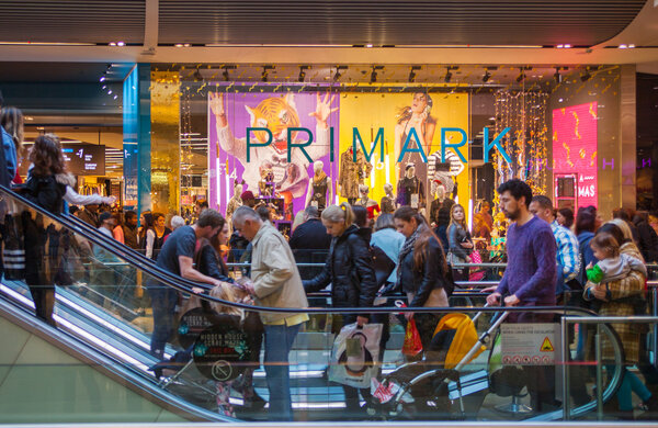 LONDON, UK - NOVEMBER 29, 2014:  Westfield Stratford City Shopping centre  with lots of people rushing for Christmas sale.