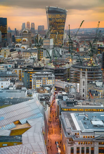 LONDON, UK - JANUARY 27, 2015: Busy streets of City of London in the dusk. First evening lights and sunset. London's panorama from the St. Paul cathedral — Stock Photo, Image