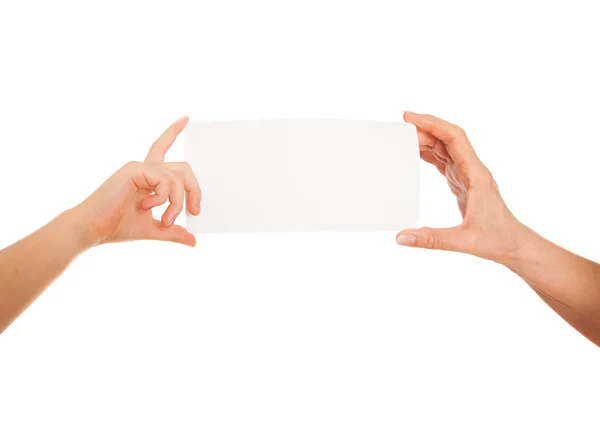 Adult's  hand and child's hand holding white paper, cardboard. White background with space for text — Stock Photo, Image