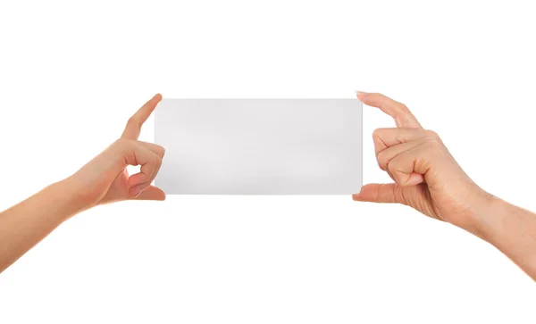 Adult's  hand and child's hand holding white paper, cardboard. White background with space for text — Stock Photo, Image