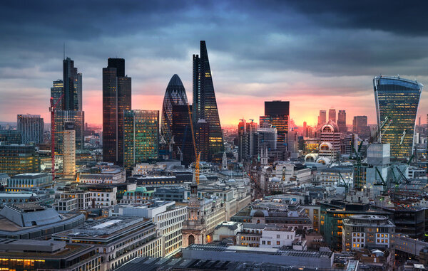 LONDON, UK - JANUARY 27, 2015: City of London, business and banking aria. London's panorama in sun set. View from the St. Paul cathedral
